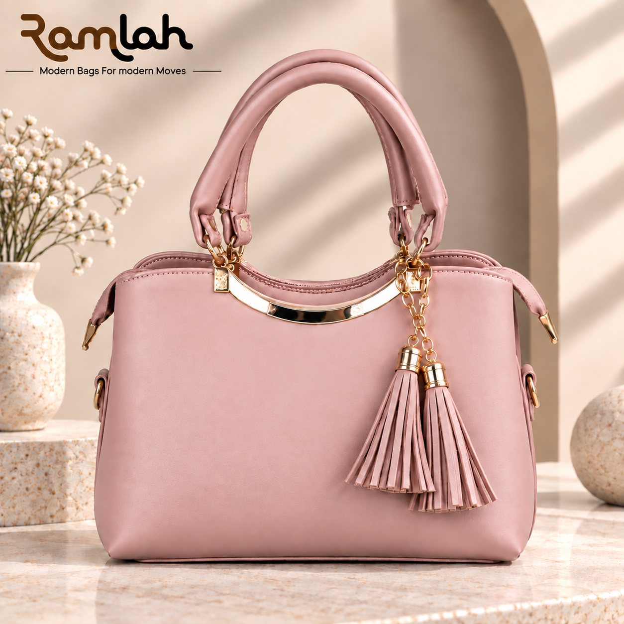 Elegant Tassel Top Handle Shoulder Bag for women in blush pink with double tassel charms and gold-tone hardware